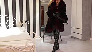 Mistress Otta in fur coat dominates with rough fingering and bdsm play.
