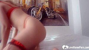 Amazing blonde in red lingerie pleasures herself