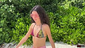 Skinny teen beauty pees on Maldives beach with golden shower twist
