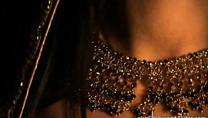 Watch this erotic brunette milf rip her clothes and dance nude!