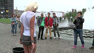 Busty blonde flaunts wet shirt in daring public display