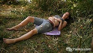 yanks honey michelle masturbates outdoors showing tan lines and nipples in high definition softcore. she reaches climax with cum