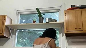 Hey, check this Latina milf enjoying herself while doing the dishes.