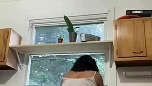 Hey, check this Latina milf enjoying herself while doing the dishes.