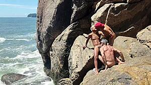 Native fishermen orgy on beach rocks
