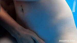 Threesome pool fun with sloppy blowjob, big pussy lips squirting, and tattooed partners.