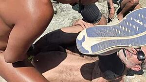 Native fishermen orgy on beach rocks