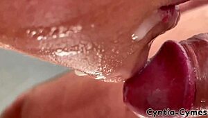 Housewife with big tits gives a sloppy blowjob while he watches porn on laptop. Massive cum in mouth!