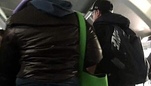 Spying on a chubby girl touching her brown nylon jacket on the street