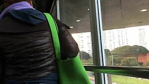 Spying on a chubby girl touching her brown nylon jacket on the street