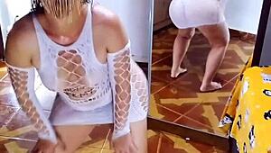 casually undressing the white sensual bodysuit and black panties in this homemade scene