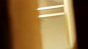 spying on a prostitute shaving her hairy pussy in secret.