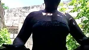 Dark skin teen flaunts her thick booty outdoors in a raw ghetto scene.