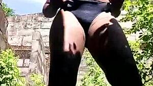 Dark skin teen flaunts her thick booty outdoors in a raw ghetto scene.