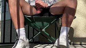 Frat guy jerks huge cock as neighbors spy