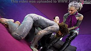 heavy tattooed sub pegged by dominas