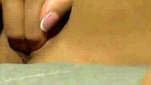 Sexy blonde watches her aroused lesbian friend touch herself