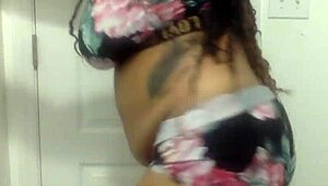 Big tit ebony milf dances in the bathroom, shaking her ass and tits around