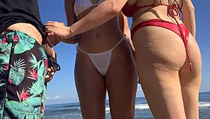 Jerking off on the beach while two sexy girls in the sea decide to join me
