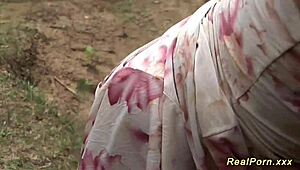 Busty German stepmom takes a black cock banging outdoors in wild group action.