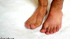 the sexy gay man shows off his huge high definition feet
