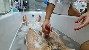 stepmom walks in to wash naked stepson, ignores huge cock in bathroom