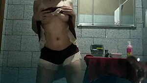 Horny Brazilian girl masturbates in the bathroom.