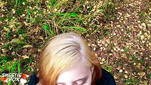 This redhead girl got sucked and banged hard out in the forest.