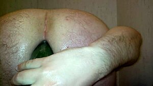 gay guy experiments with a vegetable in the shower