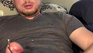 Flexible guy masturbates with plug