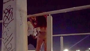 Couple enjoying intimacy on the bridge