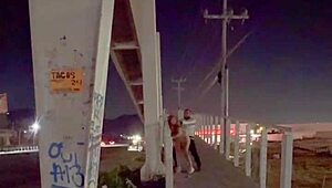 Couple enjoying intimacy on the bridge