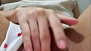 Brazilian babe rips her pussy open swallowing a thick rubber cock in solo play.