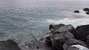 Unexpected cumshot hits nudist girlfriend's face on beach while cuckold watches!