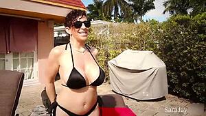 Sara Jay Teases Herself in Black Bikini by Poolside