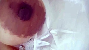 Hot milf teases with solo fingering of her wet pussy in steamy lingerie