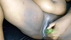 a stunning black ebony girl experiments with a cucumber on her creamy pussy. it’s her first wild ride!