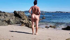 Curvy Nudist Wife Flaunts Hairy Pussy on Public Beach in Softcore Scene.