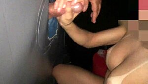 old handjob through gloryhole leads to cum on tits and jizz in cuckold cumshot scene