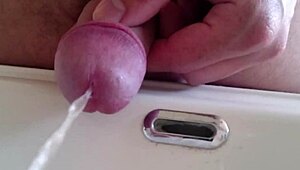 pissing in the sink with closeup