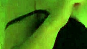 A MILF smokes while spanking her ass and masturbating