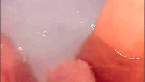 pretty woman teases in jacuzzi, masturbating to loud cumshot