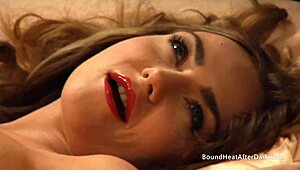 Naked lesbian madame lies on the bed, fingering herself to a wild climax