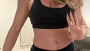 mature housewife bodybuilder flexing muscular body at home