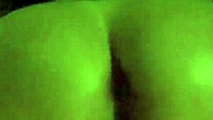 A MILF smokes while spanking her ass and masturbating