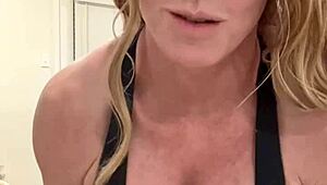 mature housewife bodybuilder flexing muscular body at home