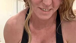 mature housewife bodybuilder flexing muscular body at home