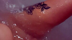 pretty woman teases in jacuzzi, masturbating to loud cumshot