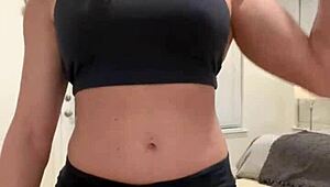 mature housewife bodybuilder flexing muscular body at home