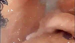 pretty woman teases in jacuzzi, masturbating to loud cumshot